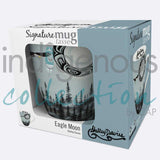 Eagle Moon Signature Mug by artist Shelley Davies. Her cultural background is Coast Salish. The artist is paid a royalty on every sale.  Mugs are 18 oz., and feature the artist's signature on the inside. They are made of fine china, individually boxed, and are microwave and dishwasher safe.
